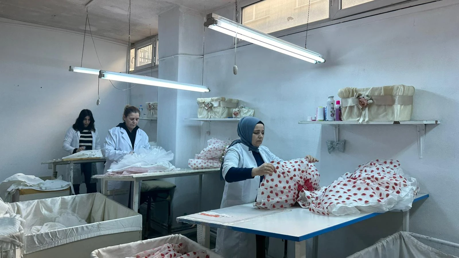 Pamina team working together at garment preparation tables